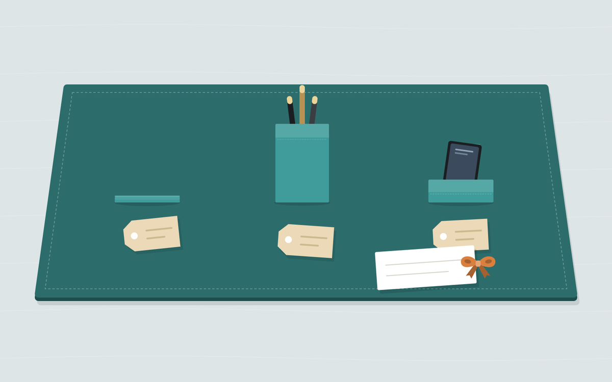 Illustration: a turquoise desk pad with three single pieces set apart, a stack of coasters, a pen cup and a phone stand, each with a blank paper tag, and a small card with an orange bow