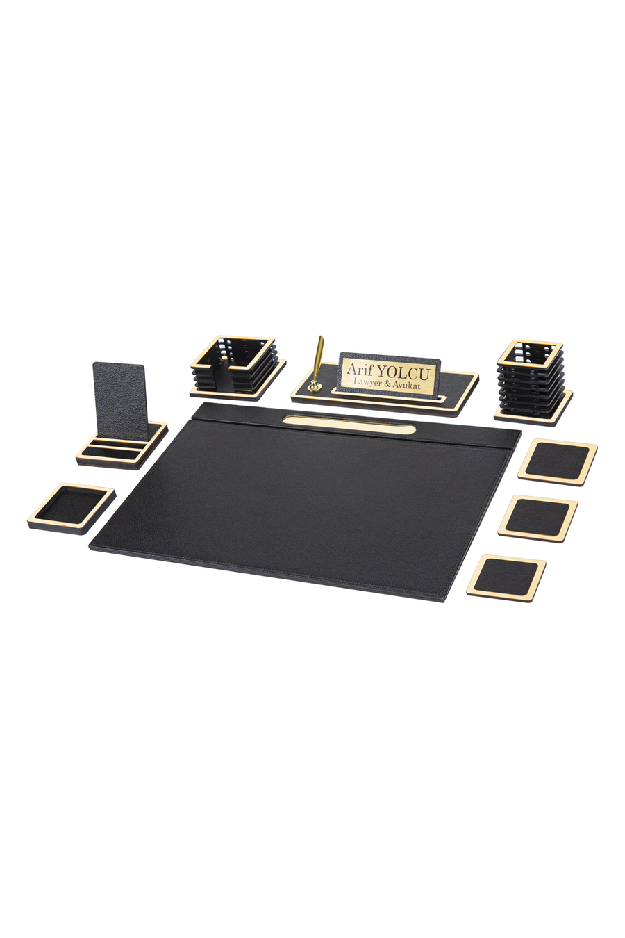 Vesta 11-piece desk set in black with gold-tone edge trim: desk pad, phone stand, memo holder, nameplate with sample text, pen cup and coasters
